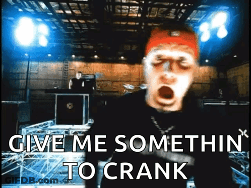 A Man With His Mouth Open And The Words Give Me Somethin To Crank Behind Him GIF