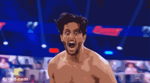 A Man With His Mouth Open In A Boxing Ring With A Sign That Says Lucky In The Background GIF
