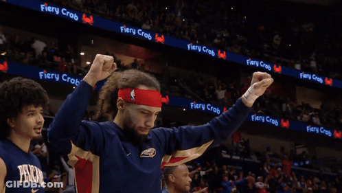 A Man With His Tongue Out Wearing A Fiery Crab Headband GIF