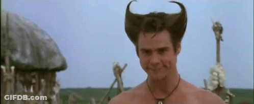 A Man With Horns On His Head Is Smiling . GIF