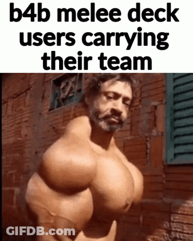 A Man With Huge Muscles Is Standing In Front Of A Brick Wall GIF
