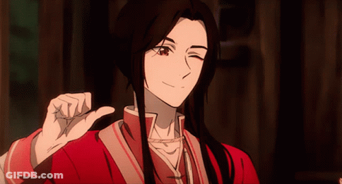 A Man With Long Black Hair Is Giving A Thumbs Up GIF
