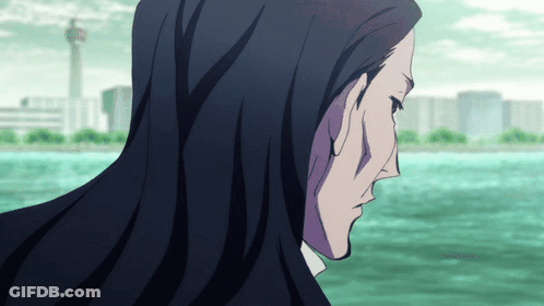 A Man With Long Black Hair Is Looking Out Over The Water GIF