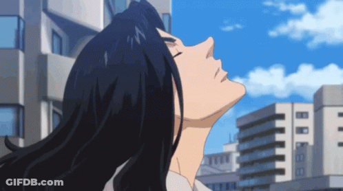 A Man With Long Black Hair Is Looking Up Into The Sky GIF