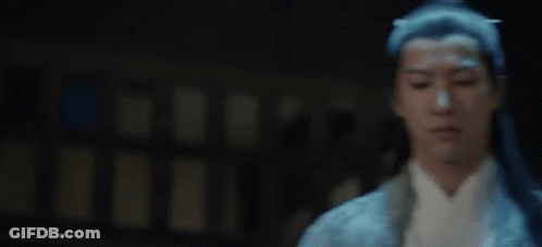 A Man With Long Black Hair Is Wearing A Blue And White Kimono . GIF