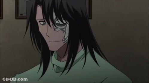 A Man With Long Black Hair Is Wearing A Green Shirt And Has The Number 3 On His Face GIF