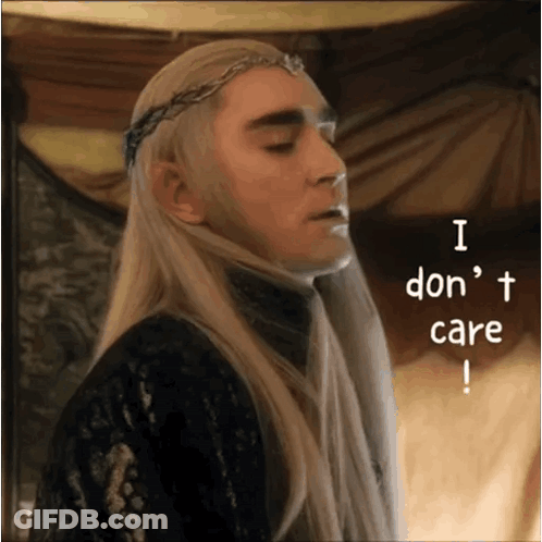 A Man With Long Blonde Hair And A Crown On His Head Says I Don 'T Care GIF