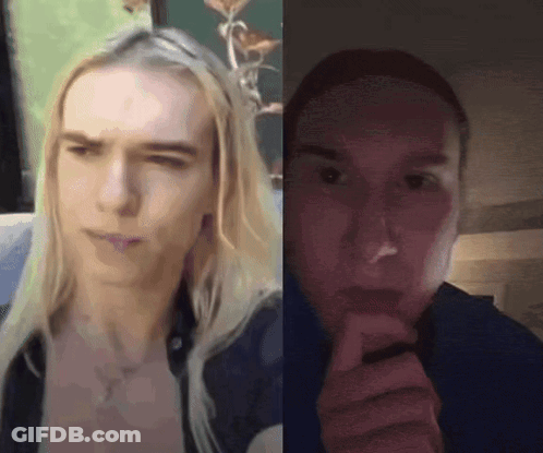 A Man With Long Blonde Hair Is Sitting Next To A Woman With Short Hair . GIF