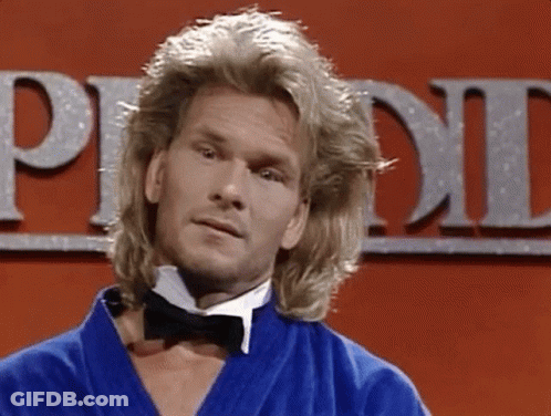 A Man With Long Blonde Hair Is Wearing A Bow Tie And A Blue Robe GIF