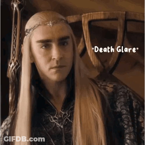A Man With Long Blonde Hair Is Wearing A Crown And The Words Death Glare GIF