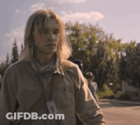A Man With Long Blonde Hair Is Wearing A Lanyard Around His Neck With The Letter D On It GIF