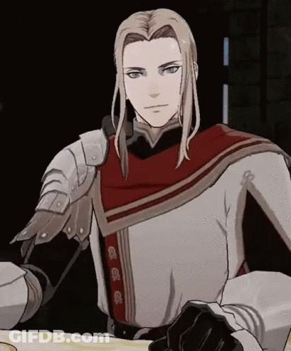 A Man With Long Blonde Hair Is Wearing Armor And A Cape GIF