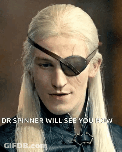 A Man With Long Blonde Hair Wearing An Eye Patch With The Words " Your Spinner Will See You Now " Below Him GIF