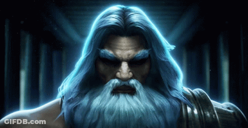 A Man With Long Blue Hair And A Beard Is Looking At The Camera GIF