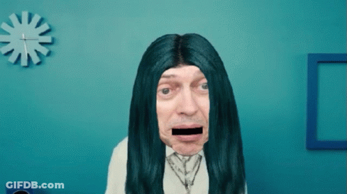 A Man With Long Blue Hair And A Black Stripe In His Mouth GIF