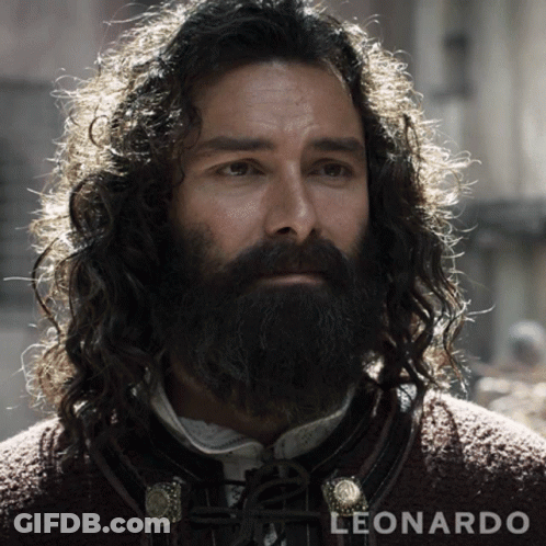 A Man With Long Curly Hair And A Beard Is Named Leonardo GIF