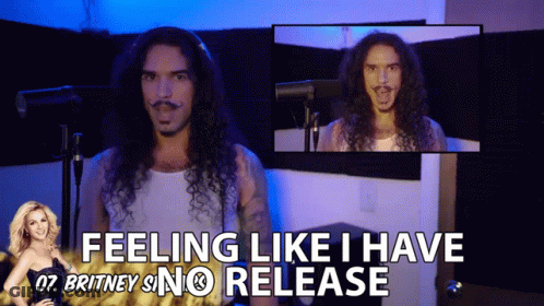 A Man With Long Curly Hair Says " Feeling Like I Have Britney Snc Release " GIF