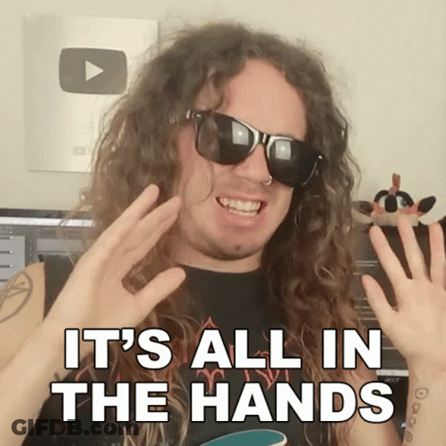 A Man With Long Curly Hair Wearing Sunglasses And A Black Shirt Says It 'S All In The Hands GIF
