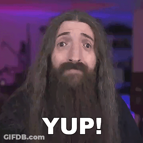A Man With Long Hair And A Beard Has The Word Yup On His Face GIF