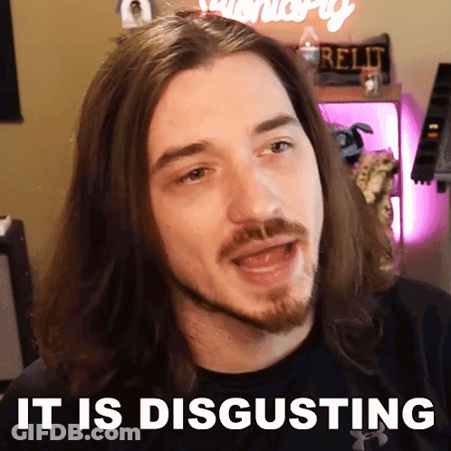 A Man With Long Hair And A Beard Has The Words It Is Disgusting Above His Head GIF