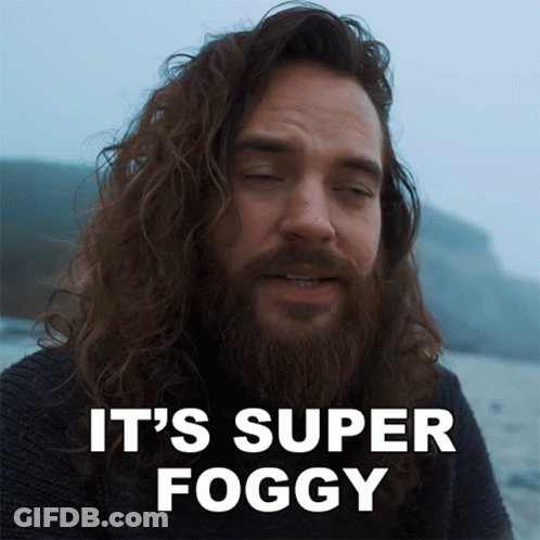 A Man With Long Hair And A Beard Has The Words It 'S Super Foggy Above Him GIF