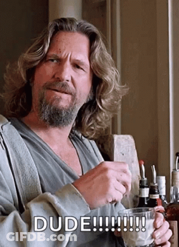 A Man With Long Hair And A Beard Holds A Glass And Says Dude !!! GIF
