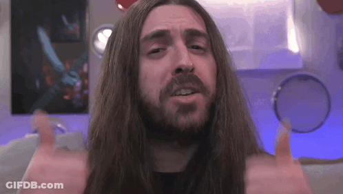 Man With Long Hair And Beard Giving Thumbs Up GIF