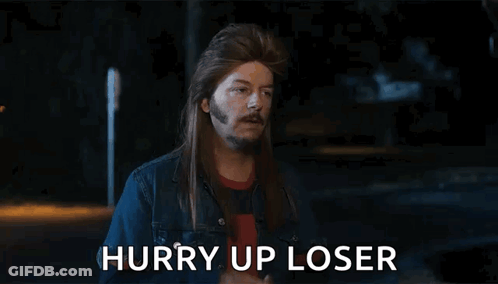 A Man With Long Hair And A Beard Is Giving The Middle Finger And The Words Hurry Up Loser Are Below Him GIF