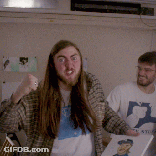 A Man With Long Hair And A Beard Is Holding A Book That Says ' Ts Stuff ' GIF
