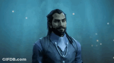 A Man With Long Hair And A Beard Is Holding A Cup In His Hand . GIF