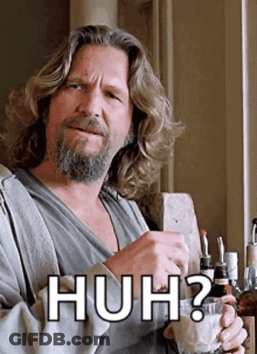A Man With Long Hair And A Beard Is Holding A Glass And Says Huh GIF