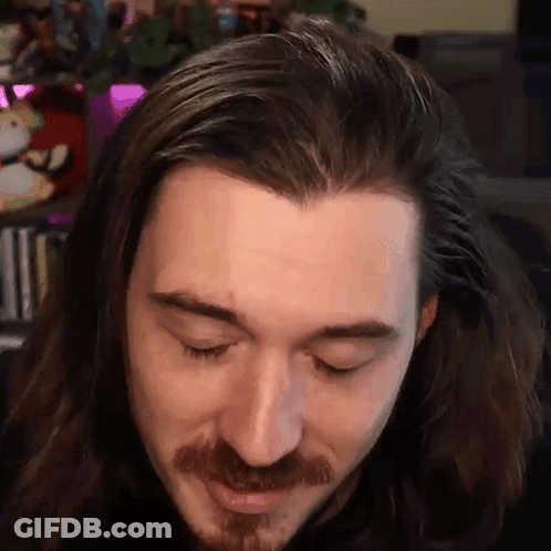 Man With Long Hair And Beard Looking Down GIF