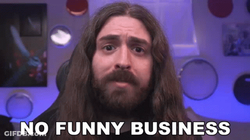 A Man With Long Hair And A Beard Is Making A Funny Face And Saying No Funny Business . GIF