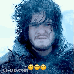 A Man With Long Hair And A Beard Is Making A Funny Face With Three Emojis . GIF