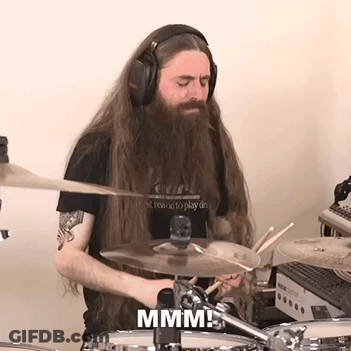 Man With Long Hair And Beard Playing Drums GIF