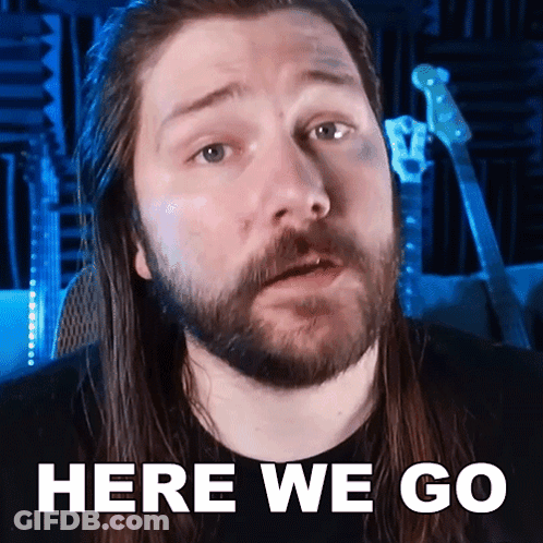 A Man With Long Hair And A Beard Is Saying " Here We Go " GIF