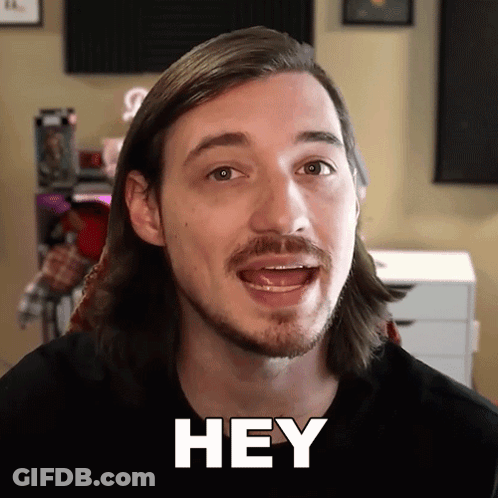Man With Long Hair And Beard Saying Hey GIF