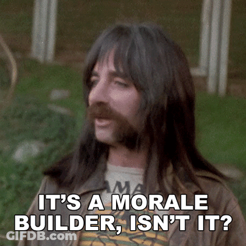 A Man With Long Hair And A Beard Is Saying It 'S A Morale Builder Isn 'T It GIF