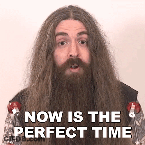A Man With Long Hair And A Beard Is Saying " Now Is The Perfect Time " GIF