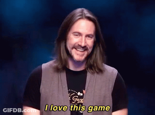 A Man With Long Hair And A Beard Is Smiling And Saying I Love This Game GIF