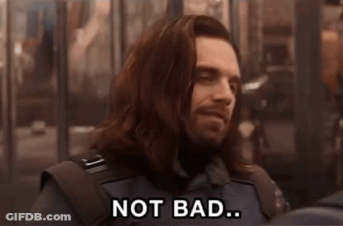 A Man With Long Hair And A Beard Is Smiling And Saying Not Bad GIF