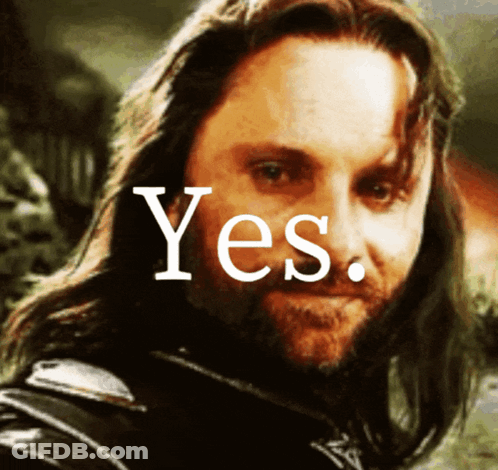 A Man With Long Hair And A Beard Is Smiling With The Word Yes Above Him GIF