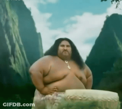 A Man With Long Hair And A Beard Is Standing In Front Of A Mountain .. GIF
