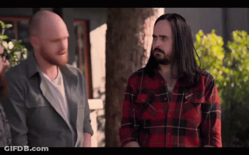 Long-Haired Bearded Man Talking To Another Man GIF