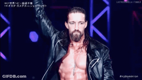 A Man With Long Hair And A Beard Is Wearing A Black Leather Jacket And Necklace GIF