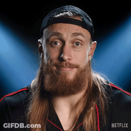 A Man With Long Hair And A Beard Is Wearing A Hat And A Shirt That Says Netflix GIF