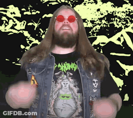 A Man With Long Hair And A Beard Is Wearing A Shirt That Says Psycho On It GIF