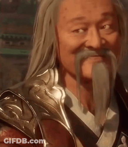 A Man With Long Hair And A Beard Is Wearing Armor And A Sword . GIF