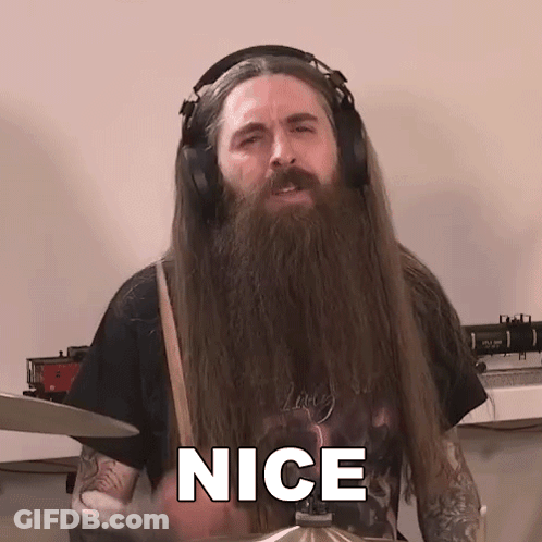 Man With Long Hair And Beard Playing Drums Saying Nice GIF