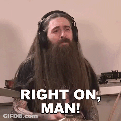 A Man With Long Hair And A Beard Is Wearing Headphones And Says Right On Man GIF